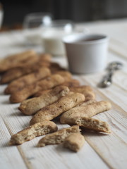 Homemade shortbread biscuits with cinnamon and nuts on a white wooden table. We bake cookies.