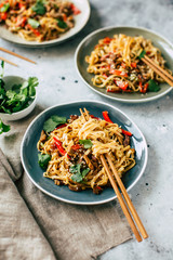 Asian food, udon noodles with vegetables, healthy vegetarian menu - 320363356