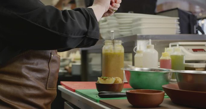 Caucasian woman cooking in the kitchen