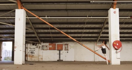 Female dancer in an empty warehouse