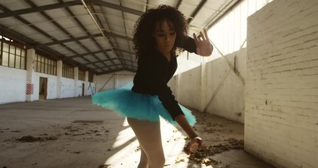 Female dancer in an empty warehouse