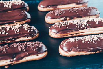  Traditional french eclairs with chocolate. Tasty dessert. Home made cake eclairs  Sweet. Dessert. Pastry filled with cream. Chocolate icing.