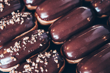  Traditional french eclairs with chocolate. Tasty dessert. Home made cake eclairs  Sweet. Dessert. Pastry filled with cream. Chocolate icing.