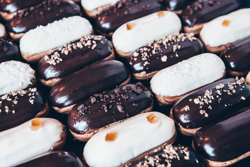  Traditional french eclairs with chocolate. Tasty dessert. Home made cake eclairs  Sweet. Dessert. Pastry filled with cream. Chocolate icing.