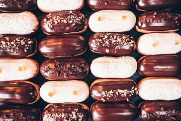  Traditional french eclairs with chocolate. Tasty dessert. Home made cake eclairs  Sweet. Dessert. Pastry filled with cream. Chocolate icing.
