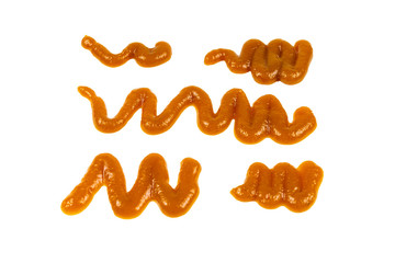 Orange sauce splashes isolated on white background