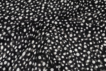 Black and white polka dots fabric texture.