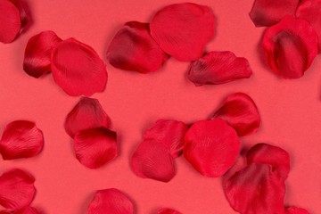 Red fabric rose petals on red background top view from above - marriage, love, wedding or valentine's day background