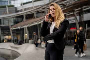 Fototapeta premium Happy Blonde Business Woman Talking On The Phone