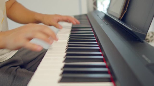 Male Hands Playing Piano. Musical Instrument Playing. Keyboard Instrument
close up shot of male practice playing digital keyboard