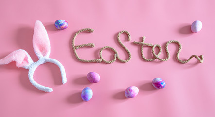 Easter creative inscription on a pink background .