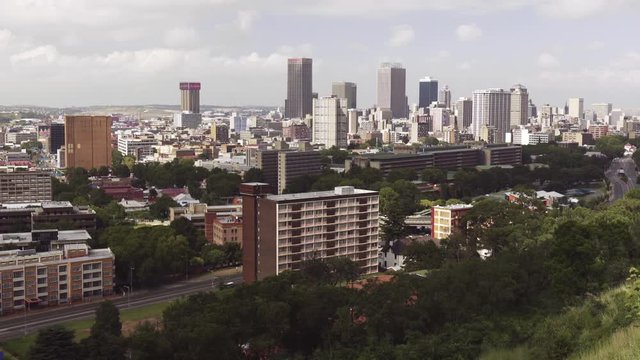 Johannesburg South Africa city skyline shot from a hill. High angle, Fixed shot, Full shot.