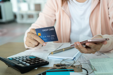 Woman holding credit card and  and saving concept..
