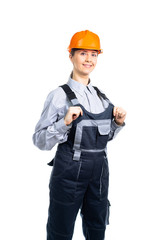A female construction engineer welcomes you to the camera. Isolated