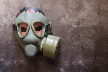 Green military gas mask for protection. 