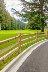 Golf course with wooden fence