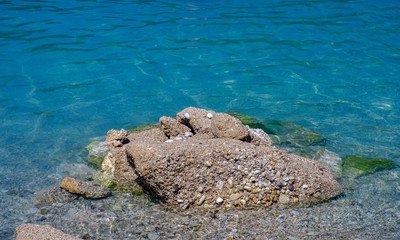 Oludeniz, Turkey. Blue Lagoon. Stones and small pebbles in the transparent sea
