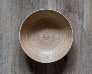 wooden bowl on wooden table from above