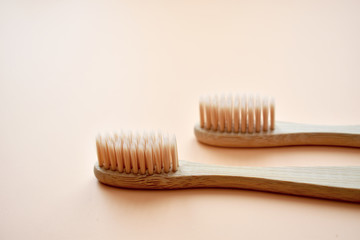 Eco-friendly bamboo tooth brush. Zero waste set on light beige natural background. Flat lay. Top view. Copy space. 