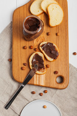 Sandwiches with chocolate paste on the table