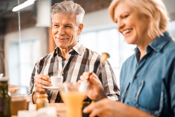 Happy mature couple is enjoying lunch together