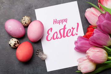 Easter greeting card with eggs and tulips
