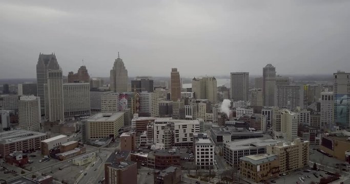 Slow panning shot of the skyscrapers and skyline of downtown Detroit, Michigan on a cloudy day. Aerial Drone