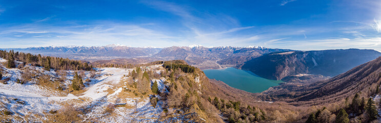 The panoramic view of the Lake santa Croce and the Dolomites from the Navegal ski resort, Italy. Drone aerial panorama 180°