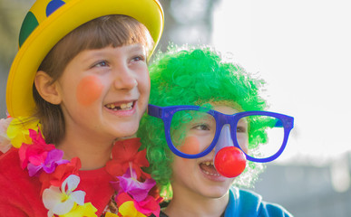 funny carnival kids smiling and playing outdoor