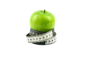 A green apple and a black and white measuring tape are all about proper nutrition.
