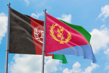 Fototapeta na wymiar Eritrea and Afghanistan flags waving in the wind against white cloudy blue sky together. Diplomacy concept, international relations.