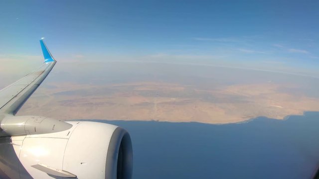 Plane Flying Over Desert and Red Sea Coast After Departing from Marsa Alam Airport, Egypt. View From a Plane.