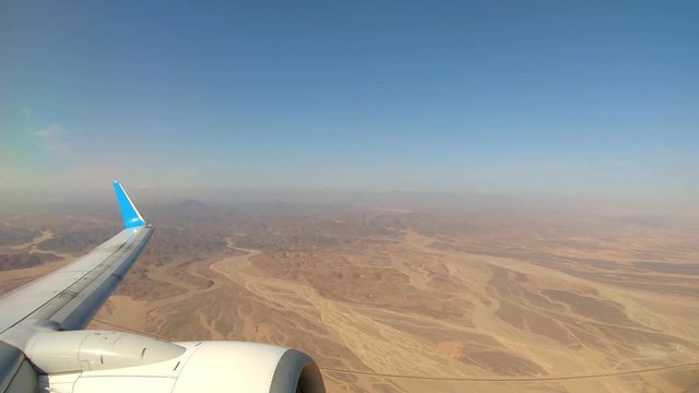 Plane Flying Over Desert After Departing from Marsa Alam Airport, Egypt. View From a Plane.