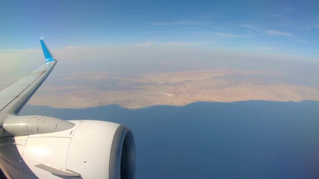 Plane Flying Over Red Sea Coastline AfterTakeoff from Marsa Alam Airport, Egypt. View From a Plane.