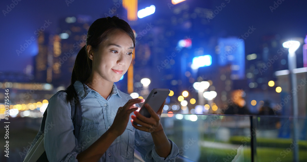 Poster Woman use of mobile phone at city