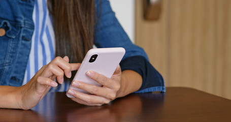 Woman use of cellphone in living room