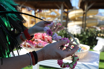 woman is holding flower