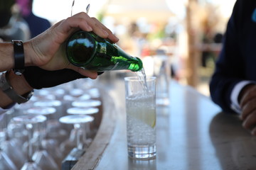 close up barman hands are preparing drink