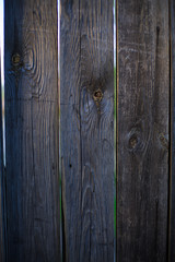 Old wooden door made of wooden boards with nails, retro wood texture