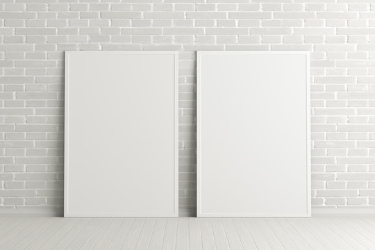 Two blank vertical posters. frame mock up standing on white floor next to white brick wall. Clipping path around posters. 3d illustration