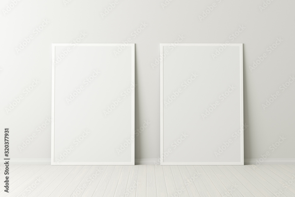 Wall mural two blank vertical posters. frame mock up standing on white floor next to white wall. clipping path 