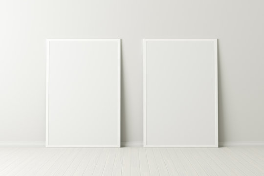 Two blank vertical posters. frame mock up standing on white floor next to white wall. Clipping path around posters. 3d illustration