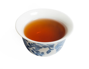 Dry Chinese oolong tea leaf and oolong tea in traditional cup on white, gaiwan tea