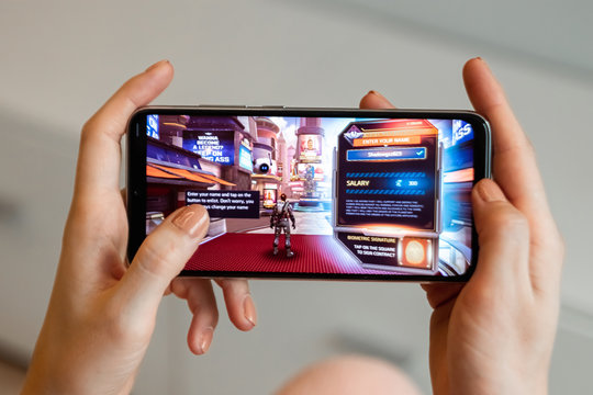 Brest, Belarus, January 31, 2020: Mobile game Shadow Gun Legends on the Xiaomi Redmi Note 8 smartphone screen close-up. A person is playing a game on a smartphone.