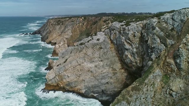 Aerial view on Atlantic coast with rock cliffs and waves in Portugal