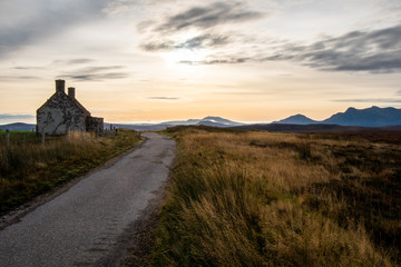 Ruined Cottage in Moorland with Scottish Mountains in the Distance