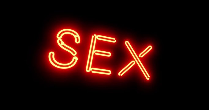 Sex sign as illuminated neon advertising for nightclub or massage. Glowing text message or fluorescent signage for love - 4k