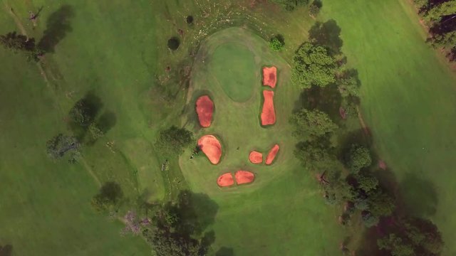 golf players at the green. Golf club Tacuru, argentina, south america. Drone air view. spotlight on the green. cinematic clockwise cameo.