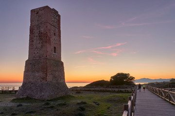 Torre de los ladrones Tower of the Thieves on sunset in Dunas de Artola natural monument, Cabopino, Andalusia, Costa del Sol - obrazy, fototapety, plakaty