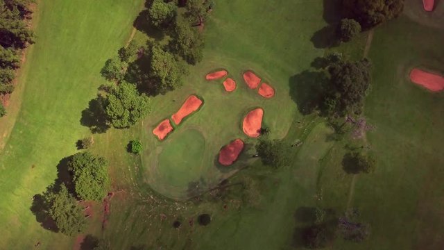 golf club Tacuru, argentina, south america. Air view, drone footage. Sunshine and shadows from clouds on the green and fairway. panoramic, still cam. drone footage.
